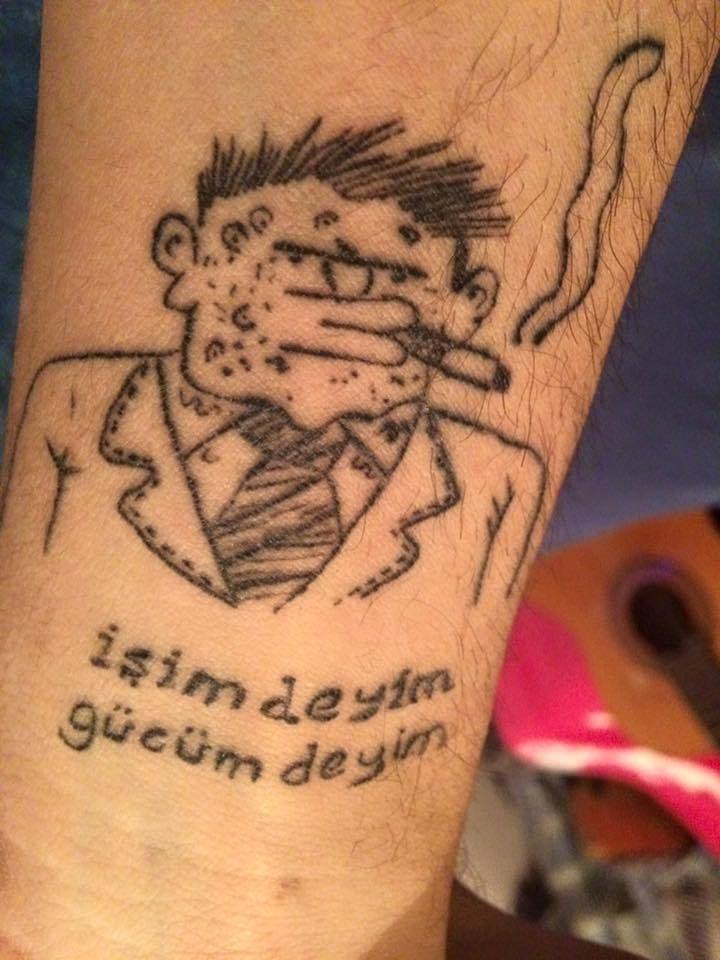 işimdeyim gücümdeyim dövmesi.